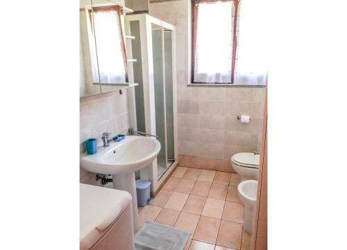 a bathroom with a sink and a toilet at Residenza Paradiso in Agra
