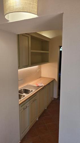 a kitchen with a sink and a counter top at Castello di Vecchienna in Monterotondo