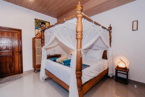 Кровать или кровати в номере 28 Degrees Lembongan
