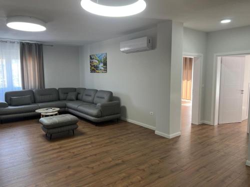 a living room with a couch and a table at Eden House in Kukës