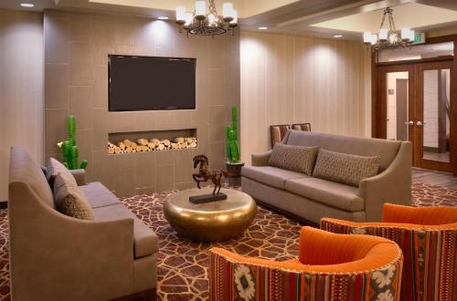 a living room with couches and a fire place at Holiday Inn Express & Suites Kanab by IHG in Kanab