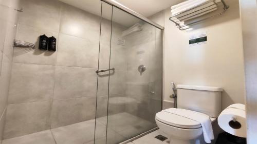a bathroom with a shower and a toilet at Holiday Inn Fortaleza by IHG in Fortaleza