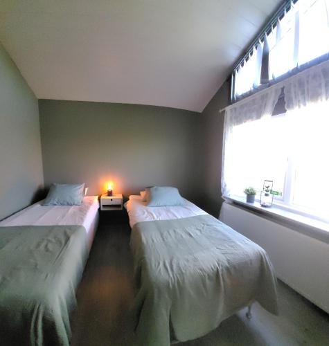 Postel nebo postele na pokoji v ubytování Efra-Sel Home