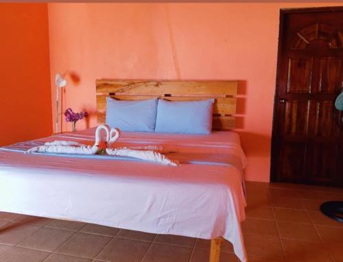 Postel nebo postele na pokoji v ubytování Kaniki Point Resort