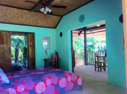 Postel nebo postele na pokoji v ubytování Kaniki Point Resort