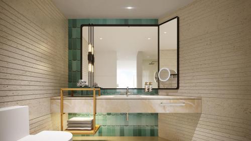 a bathroom with a sink and a mirror at Holiday Inn Pattaya by IHG in Pattaya Central