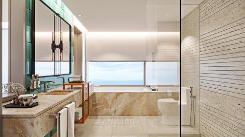 a bathroom with a tub and a sink at Holiday Inn Pattaya by IHG in Pattaya Central