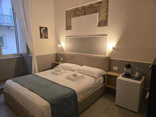Cama o camas de una habitación en Ideal City Walk