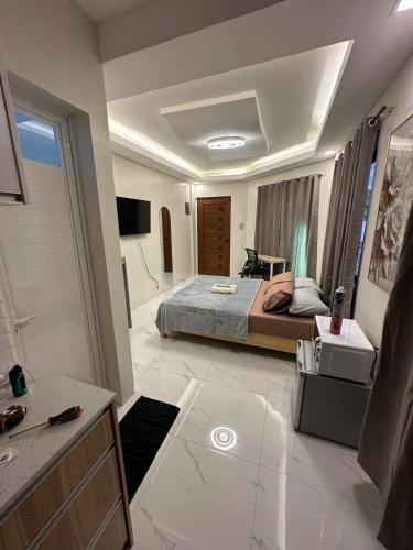 a bedroom with a bed and a bathroom at Casa Leveria Unit 9 with Balcony, Inquire Parking Availability in Imus