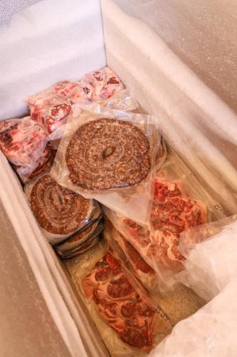 a box filled with different types of pizzas at Rolling Hills Farmstead in Caledon