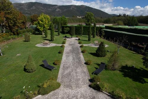 an aerial view of a garden with chairs and trees at La Dimora del Baco Hotel in LʼAquila