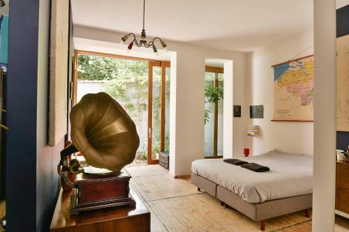 a bedroom with a bed and a large window at B'Kanal in Brussels