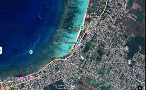 a map of a road next to the water at Epic Lodge in Trou aux Biches