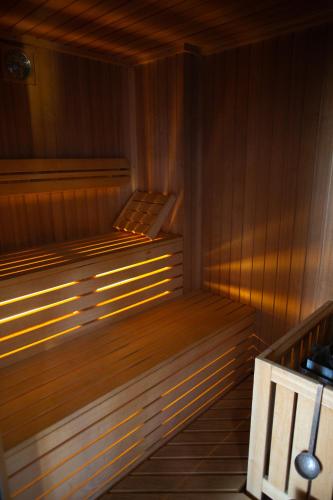 a sauna with a bench in a wooden room at La Dimora del Baco Hotel in LʼAquila