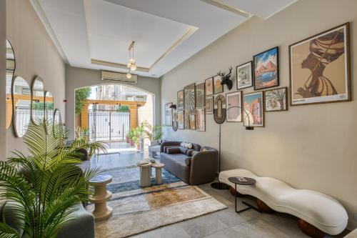 a living room with a couch and a table at Prime Residence New Cairo in Cairo