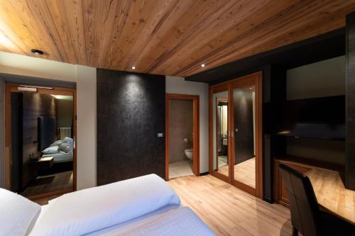 Letto o letti in una camera di Sport Hotel S. Vigilio