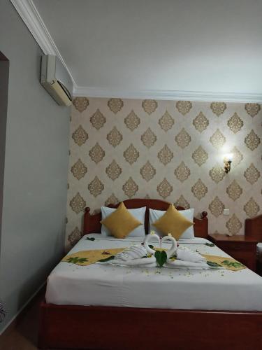 Ένα ή περισσότερα κρεβάτια σε δωμάτιο στο RatanakCity hotel