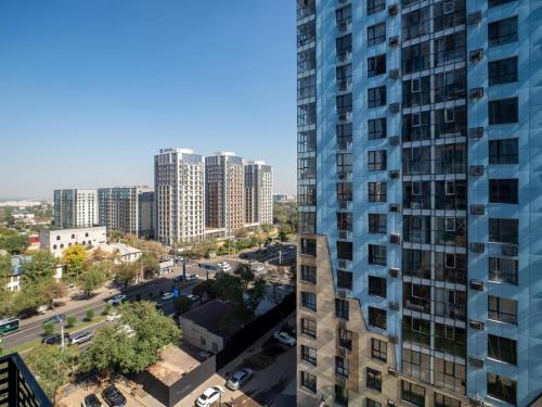 an aerial view of a city with tall buildings at Комфортная евродвушка у проспекта Абая, рядом с метро in Almaty