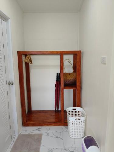 a mirror in the corner of a room at MookSkyDawBungalow in Trang