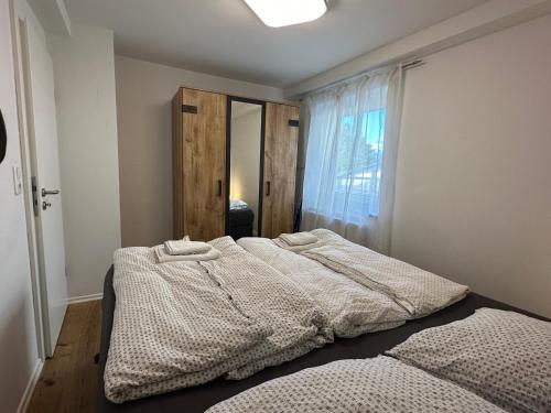 Postel nebo postele na pokoji v ubytování Traumhaftes Apartment mit Exclusiver Ausstattung + WLAN gratis