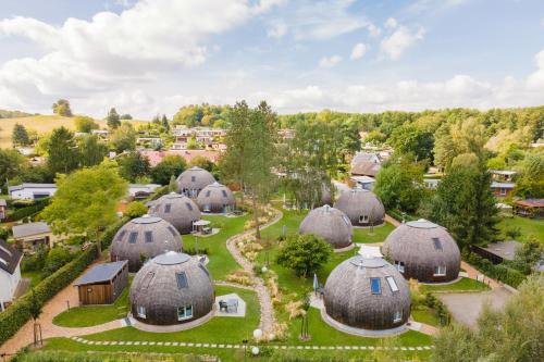 an aerial view of a village with domes at Selene in Wustrow