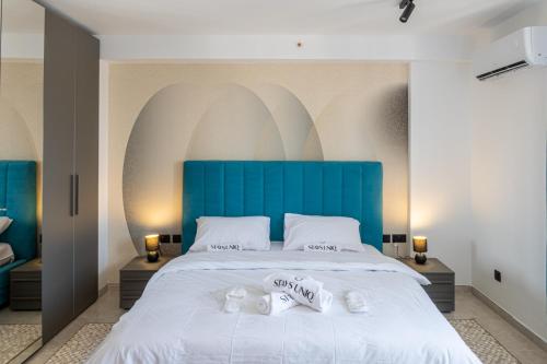 Ένα ή περισσότερα κρεβάτια σε δωμάτιο στο Offshore Suites Apartments in St Julians Centre