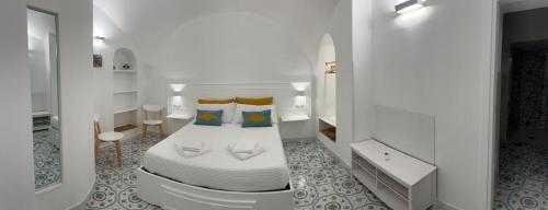 Ένα ή περισσότερα κρεβάτια σε δωμάτιο στο Casa Turchese Amalfi