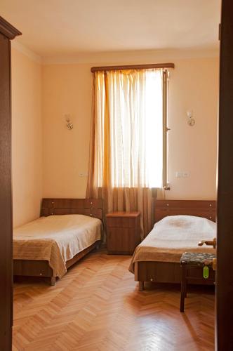 Katil atau katil-katil dalam bilik di Sighnaghi Hotel Fence Door&Сигнахи Отель Ворота Крепости&სიღნაღი სასტუმრო გალავნის კარი