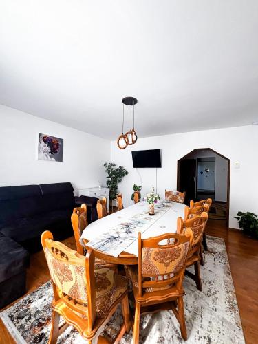 a dining room with a table and chairs at Casa Irina in Mănăstirea Humorului