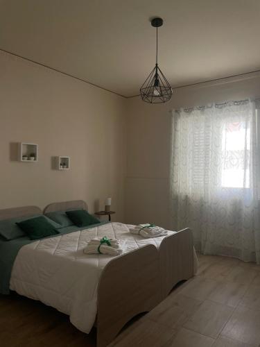 Postel nebo postele na pokoji v ubytování B&B Faro di Luce