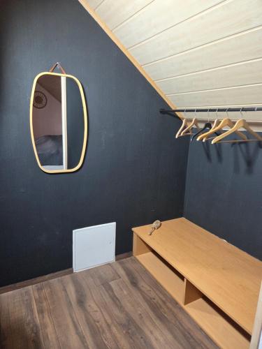 a room with a table and a mirror on the wall at Ferienwohnung Rosi in Sankt Ulrich