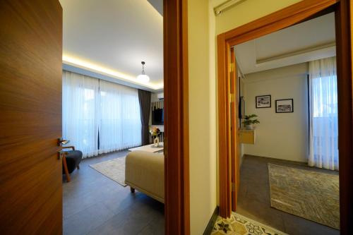 a room with a bedroom and a bed and a door at newlife cappadocia in Nevsehir