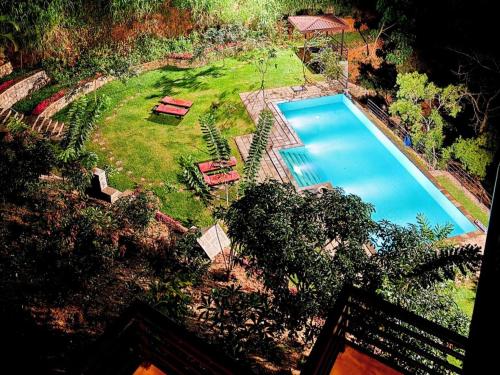 an overhead view of a swimming pool in a yard at Aqua Dunhinda Nature Retreat in Kandy