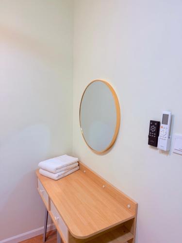 a dressing table with a mirror on a wall at Cozy Stay at Dian Residency Condominium, Shah Alam in Shah Alam