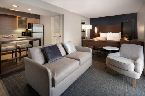 a living room with a couch and a bed at Residence Inn by Marriott Las Vegas Convention Center in Las Vegas
