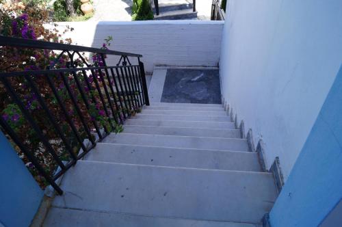 a set of stairs leading up to a building at Modernes Ferienhaus in toller Lage in Chrani