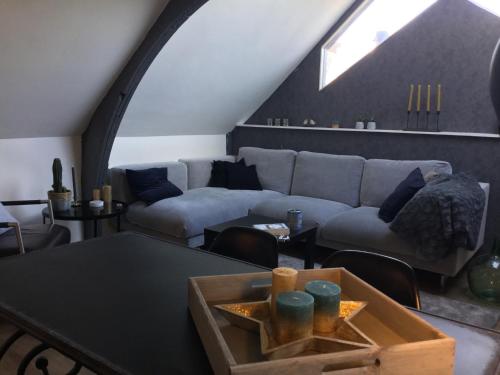a living room with a couch and a table at Appartementen Purmerend B in Purmerend