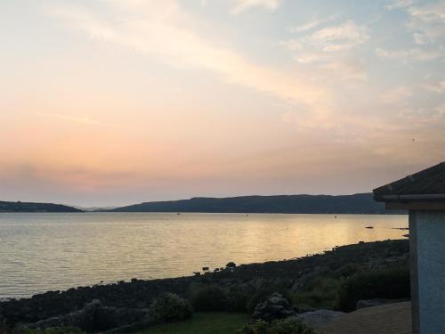 a view of a body of water at sunset at Shore House in Kilcreggan