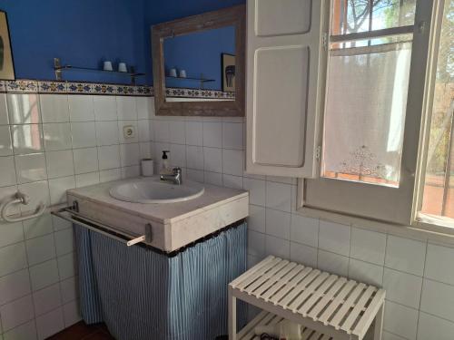 a bathroom with a sink and a mirror at vistas y relax 126m privados con piscina No cocina in Costa del Maresme