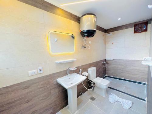 a bathroom with a sink and a toilet at Lavista pyramids view hotel in Cairo