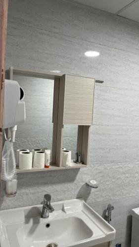 a bathroom with a sink and a mirror at Milky Way Luxury Camp in Wadi Rum