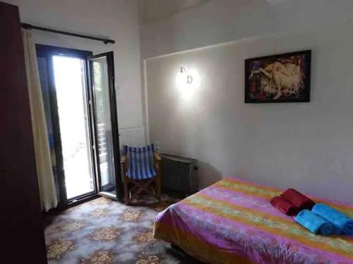 Ένα ή περισσότερα κρεβάτια σε δωμάτιο στο Villa Roula Suite