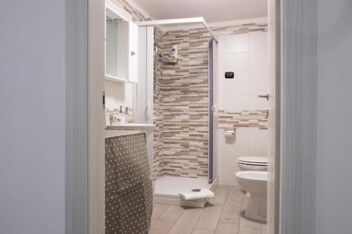 a bathroom with a shower and a toilet in it at Micky House in San Marzano sul Sarno