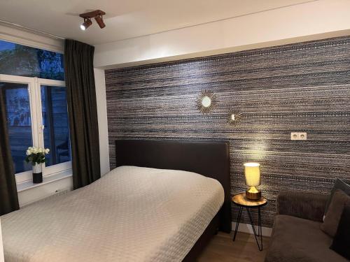 Postel nebo postele na pokoji v ubytování Luxury Leidseplein with Private Patio