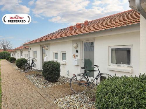 two bikes parked in front of a house at 4 person holiday home in Ærøskøbing-By Traum in Ærøskøbing
