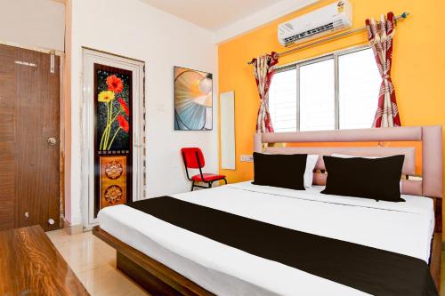 Ένα ή περισσότερα κρεβάτια σε δωμάτιο στο Hotel O Relax INN