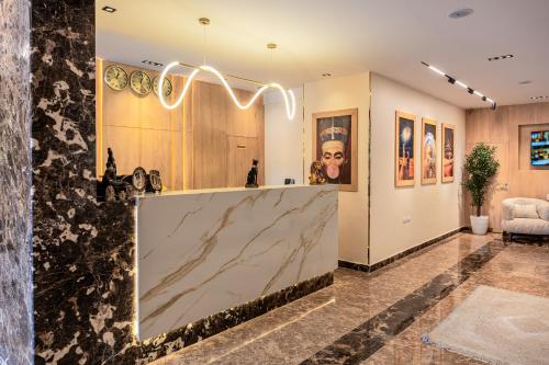 a lobby with a marble counter in a room at Pyramids sunrise inn in Cairo