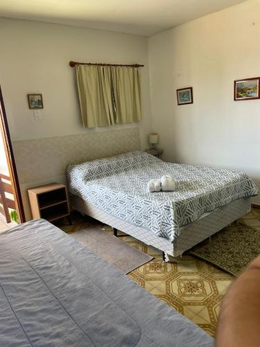 Ένα ή περισσότερα κρεβάτια σε δωμάτιο στο Pousada Zenite