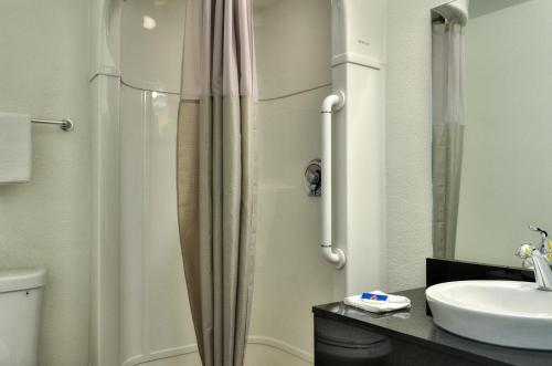 a bathroom with a shower and a sink at Motel 6-Santa Nella, CA - Los Banos - Interstate 5 in Santa Nella