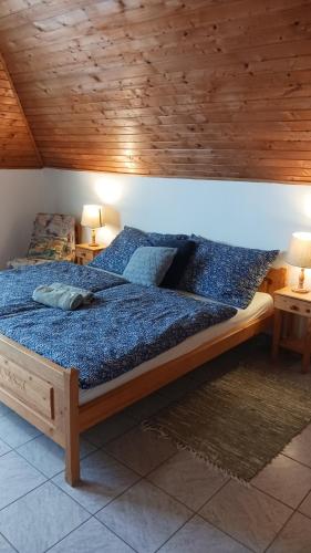 Postel nebo postele na pokoji v ubytování Mária Apartmanház